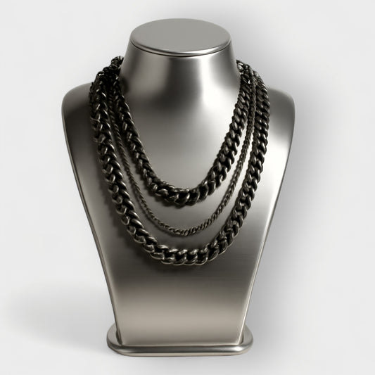 Black aluminium and metal chain necklace on a metallic mannequin bust against a white background