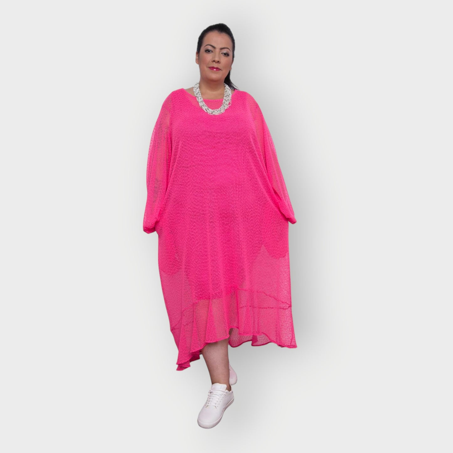 Women's Aphrodite Plus Size Hot Pink Holiday Resort Dress with a hot pink undergarment shown, paired with a white necklace and white sneakers