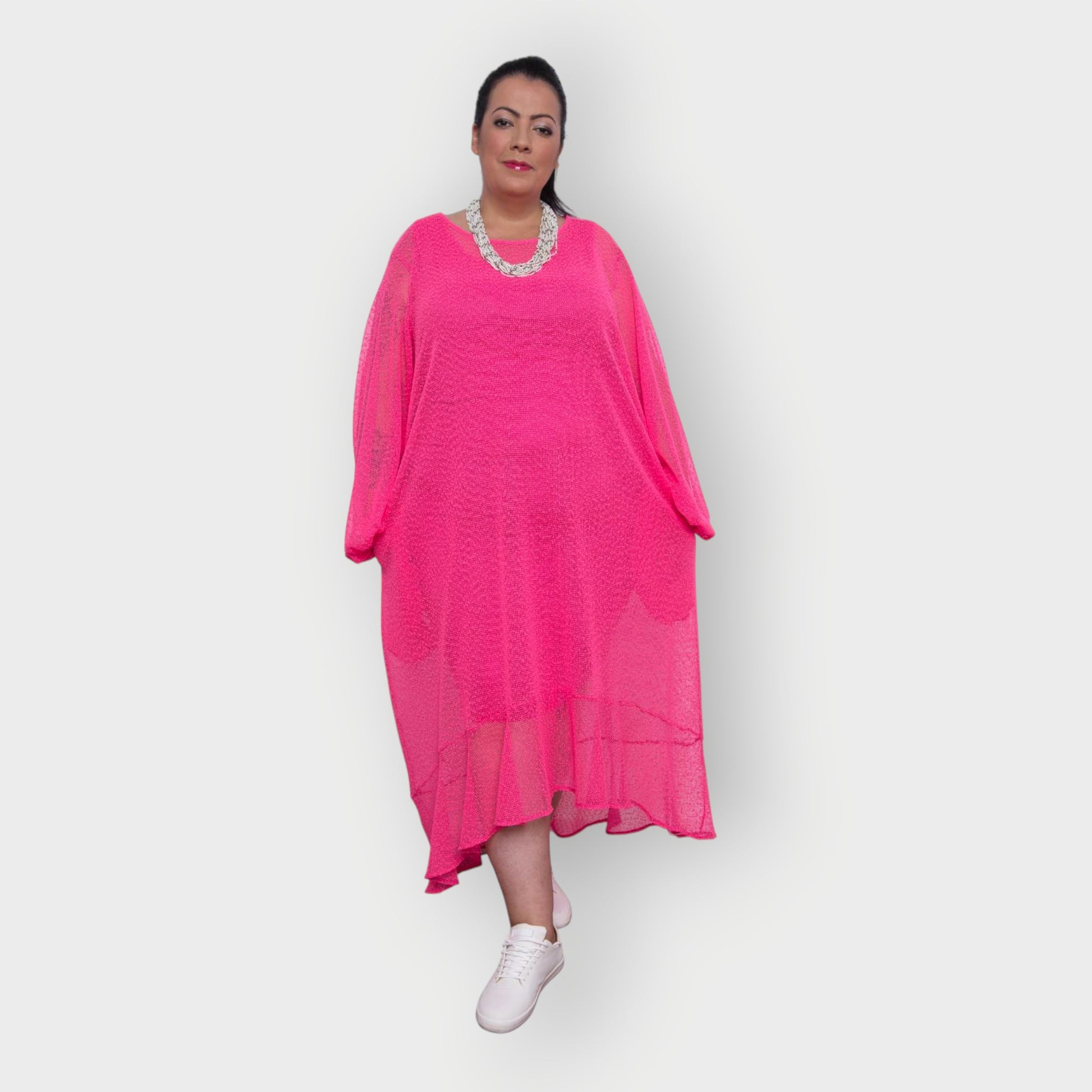 Women's Aphrodite Plus Size Hot Pink Holiday Resort Dress with a hot pink undergarment shown, paired with a white necklace and white sneakers