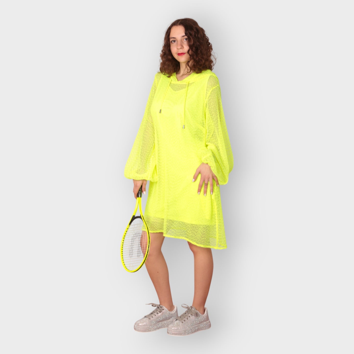 Women wearing a Plus Size Aphrodite Neon Lime Holiday Resort Dress with matching neon lime undergarment and hoodie. Straight cut short version photogrpahed from the front.