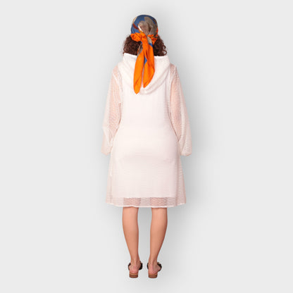 Women is wearing a UK12/ US10  Aphrodite White Holiday Resort Dress with matching white undergarment and hoodie  Short Version photographed from the back.