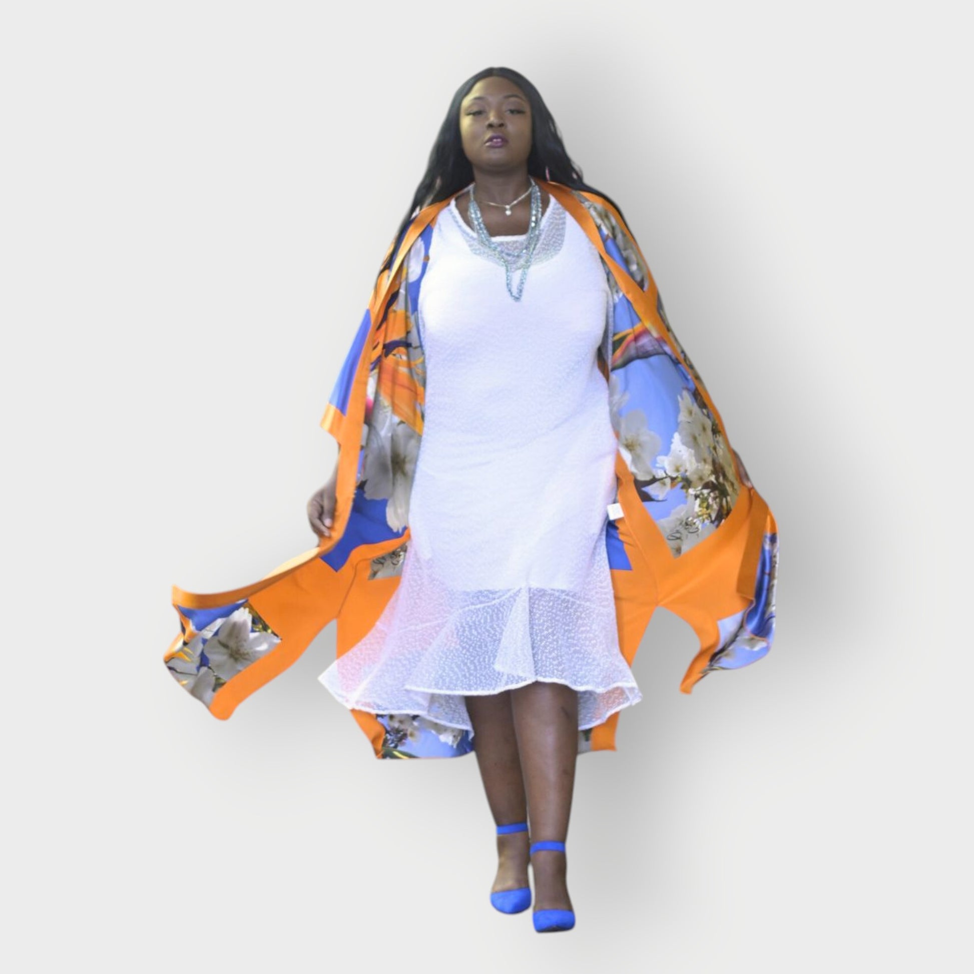 Plus Size woman wearing a Bird of Paradise White Blue Cherry Blossom Silk Kimono garment over a white dress on a white background