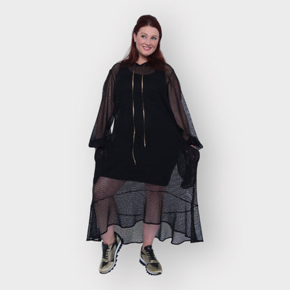 Plus Size Aphrodite Black Holiday Resort Dress with hoodie and black undergarment shown from the front, paired with gold and black sneakers.