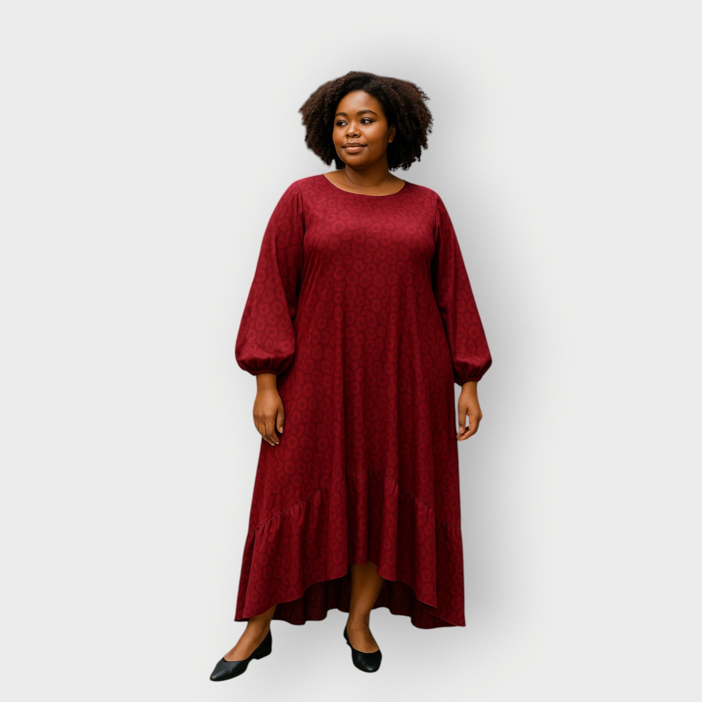 Plus Size Woman wearing a red dress against a white background
