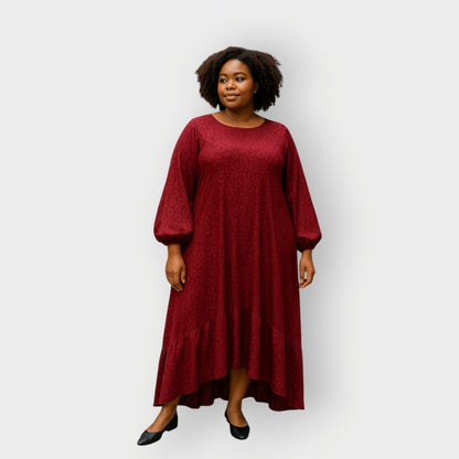 Plus Size Woman wearing a red dress against a white background