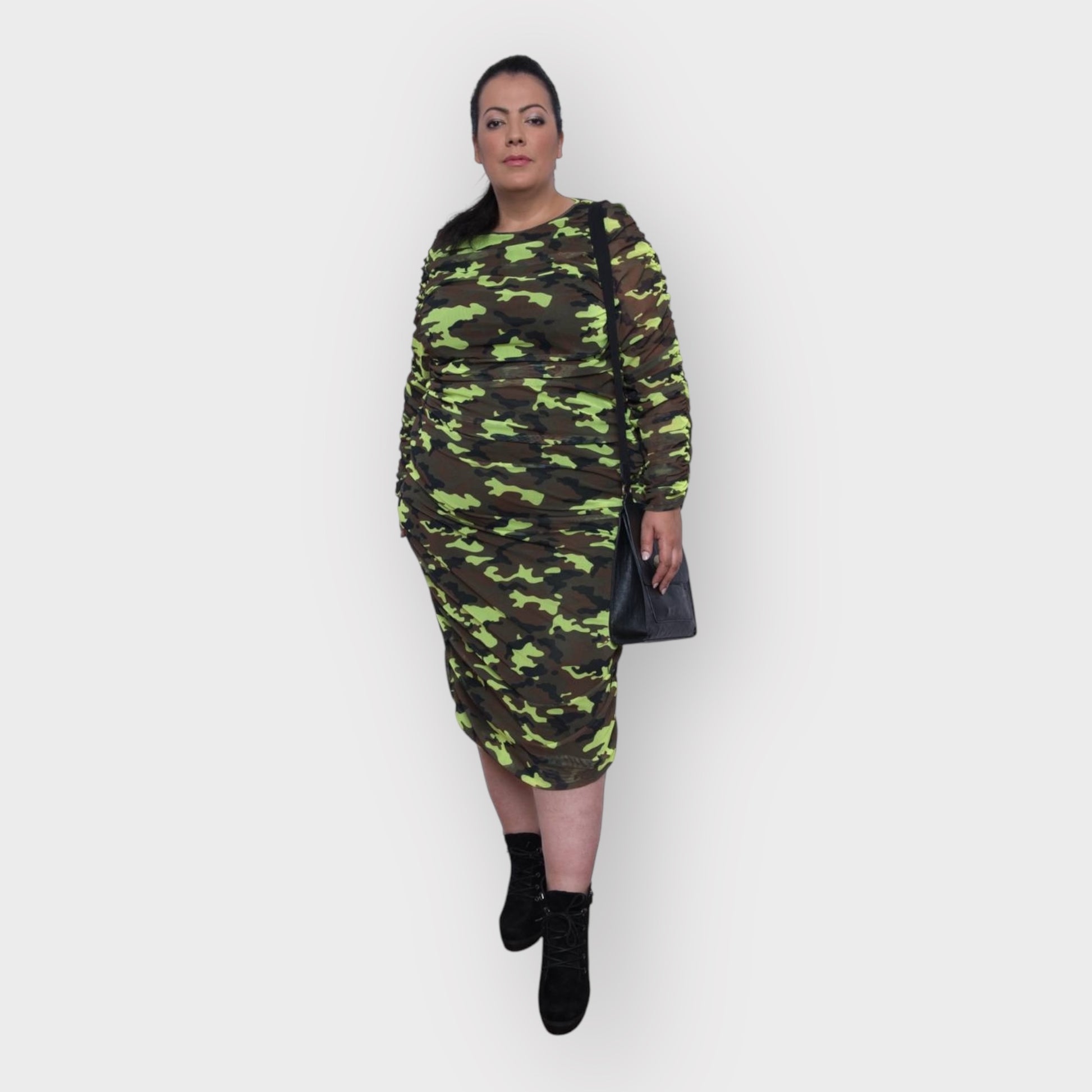 Women's Plus Size Neon Lime Brown Black Camouflage Bodycon Midi Dress styled with black heels for a bold and chic look.