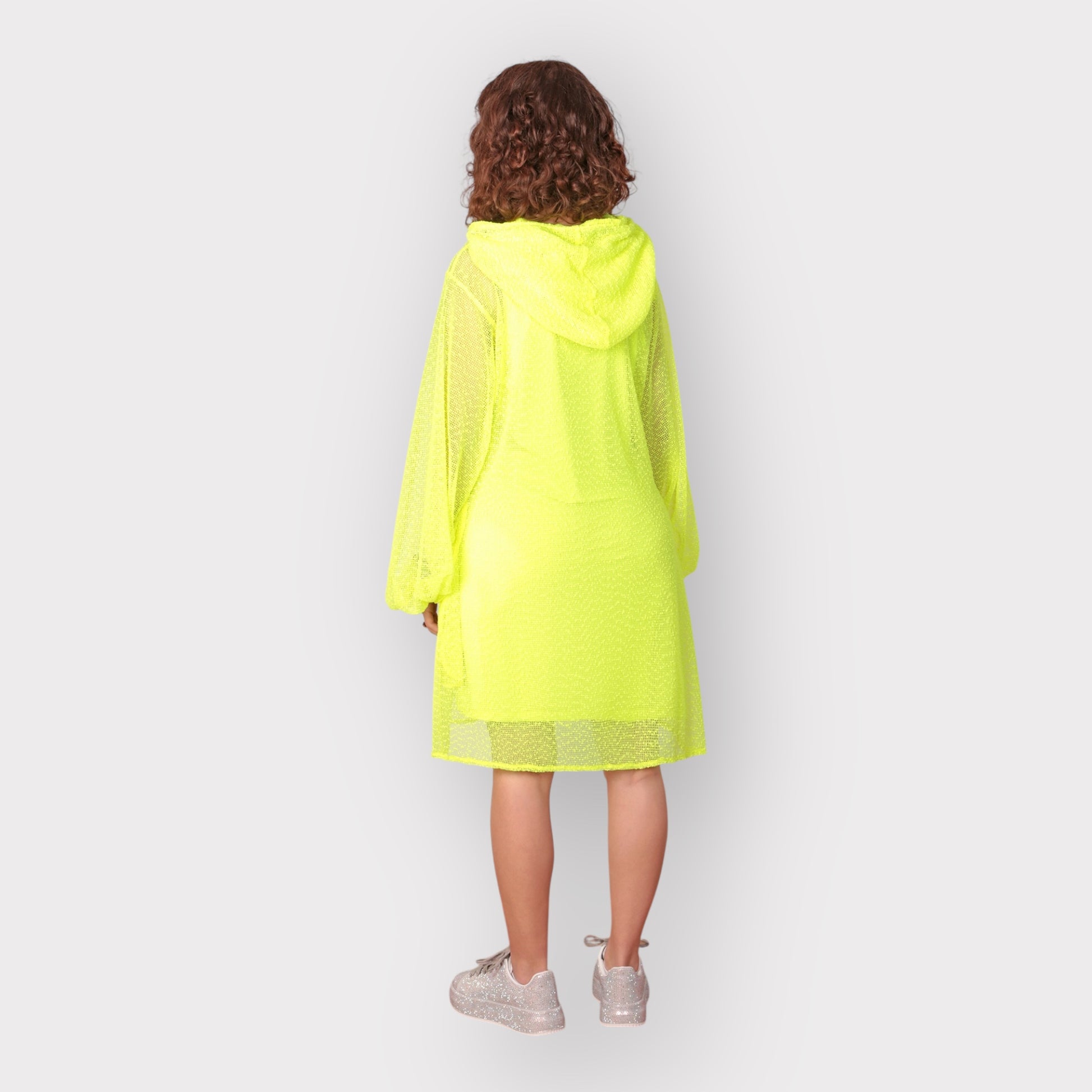 Women wearing a Plus Size Aphrodite Neon Lime Holiday Resort Dress with matching neon lime undergarment and hoodie. Straight cut short version photogrpahed from the black.