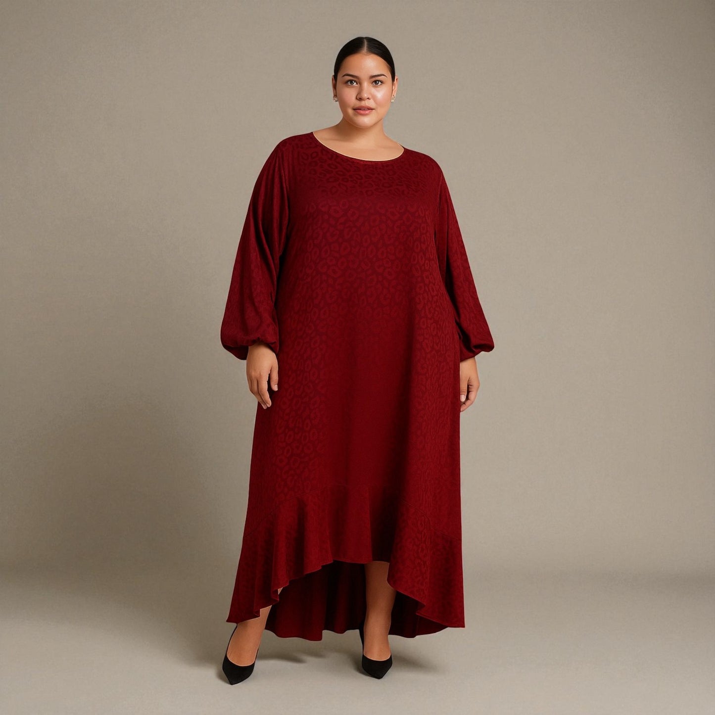 Plus Size Woman wearing a red burgundy Leopard dress against a plain background