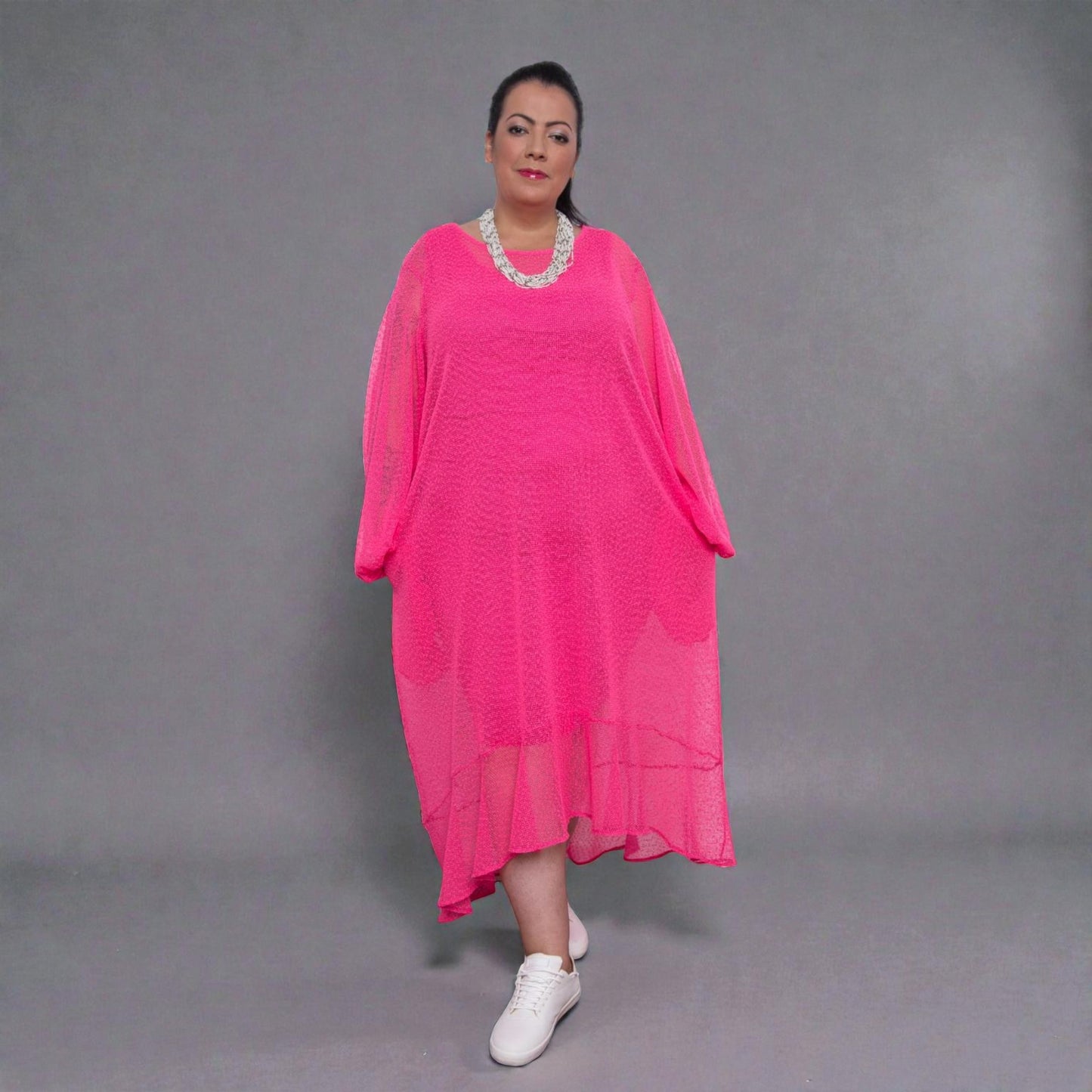 Women's Aphrodite Plus Size Hot Pink Holiday Resort Dress with a hot pink undergarment shown, paired with a white necklace and white sneakers