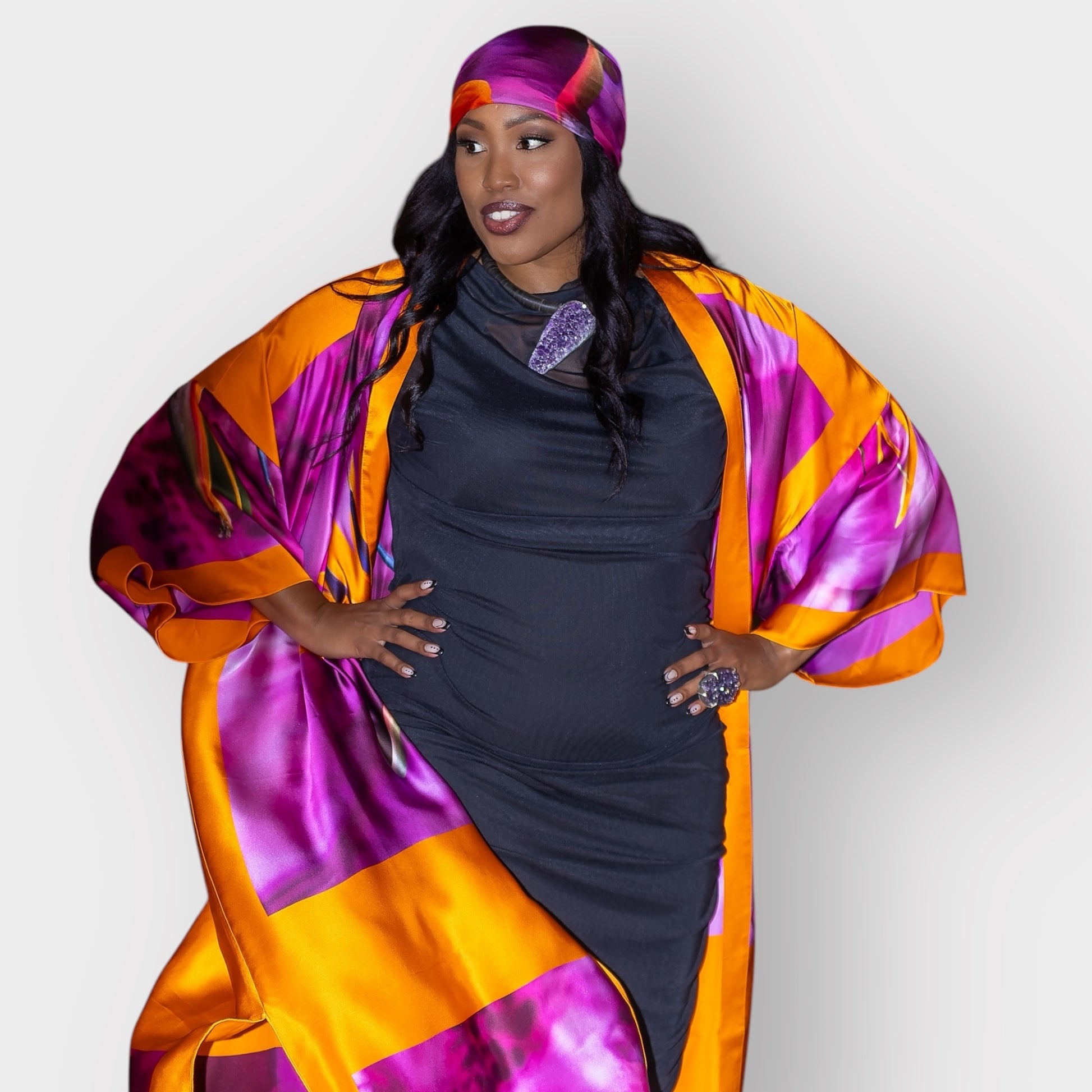 Women's Bird of Paradise Pink Purple Plus Size and Mid Size Silk Kimono styled with the Boudicca Black Dress and  amethyst stone necklace by Veronique Designs.