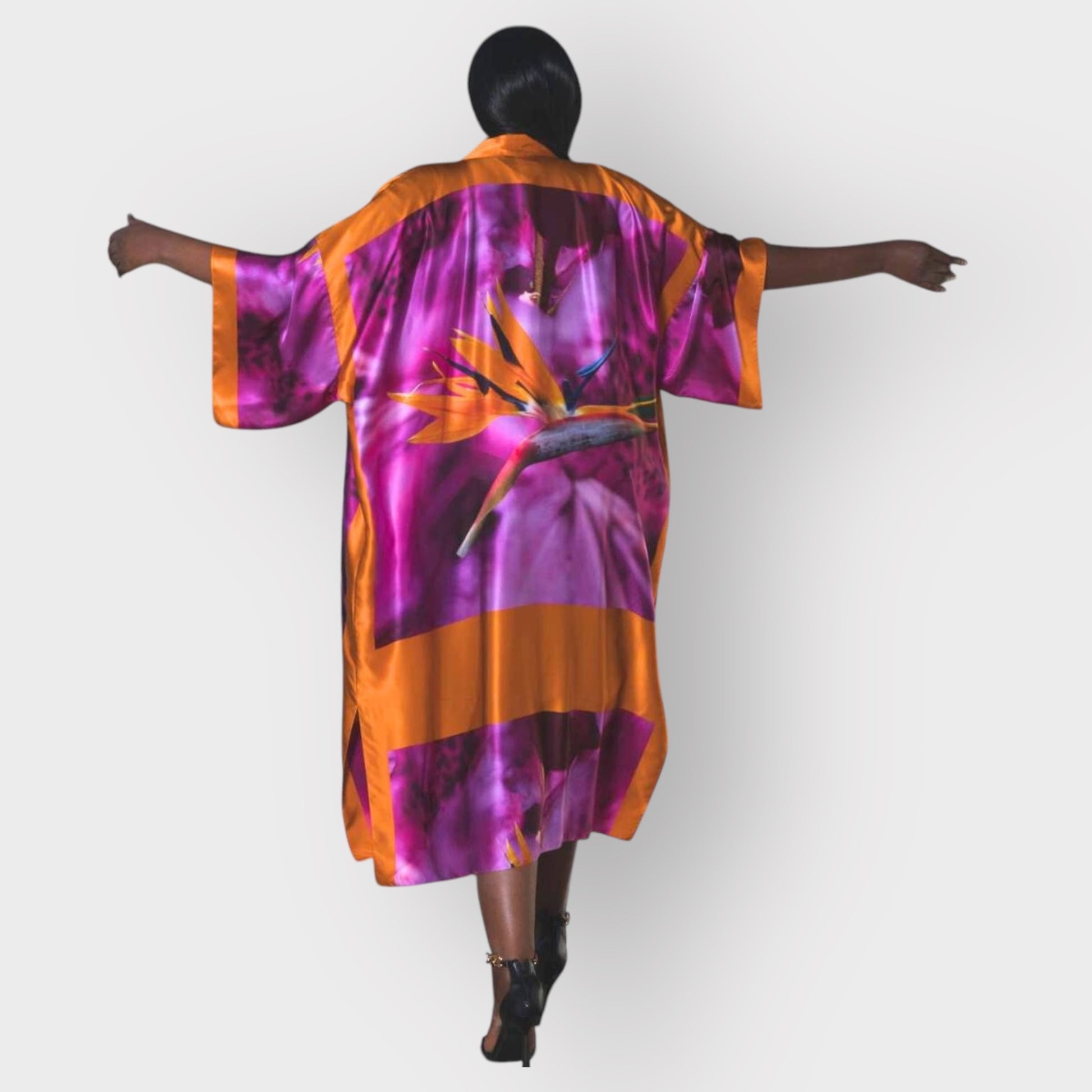 Bird of Paradise Pink Purple Plus Size and Mid Size Silk Kimono shown from the back, with the model wearing heels for an elegant appearance.