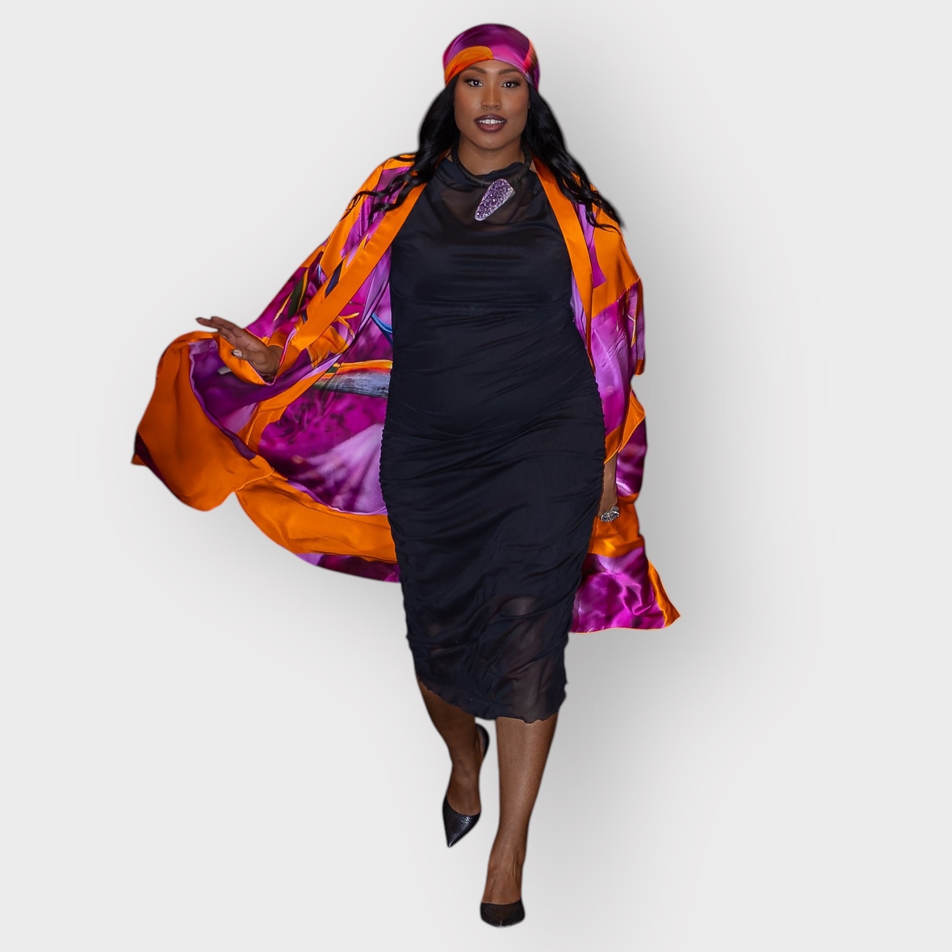 Women's Bird of Paradise Pink Purple Plus Size and Mid Size Silk Kimono styled with the Boudicca Black Dress, amethyst stone necklace by Veronique Designs and black heels for an elegant look.