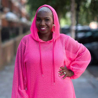 Women's Plus Size Aphrodite Hot Pink Holiday Resort Dress with matching hot pink undergarment and hoodie, styled with golden earrings.