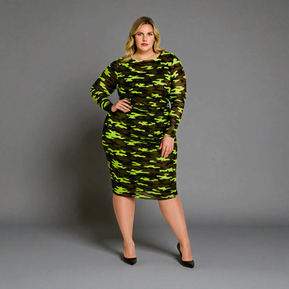 Women's Plus Size Neon Lime Brown Black Camouflage Bodycon Midi Dress styled with black heels for a bold and chic look.Grey Background.