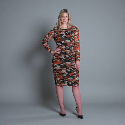 Women's Mid Size Orange Green Grey Camouflage Bodycon Midi Dress styled with black heels for a modern, stylish look.Plain background.