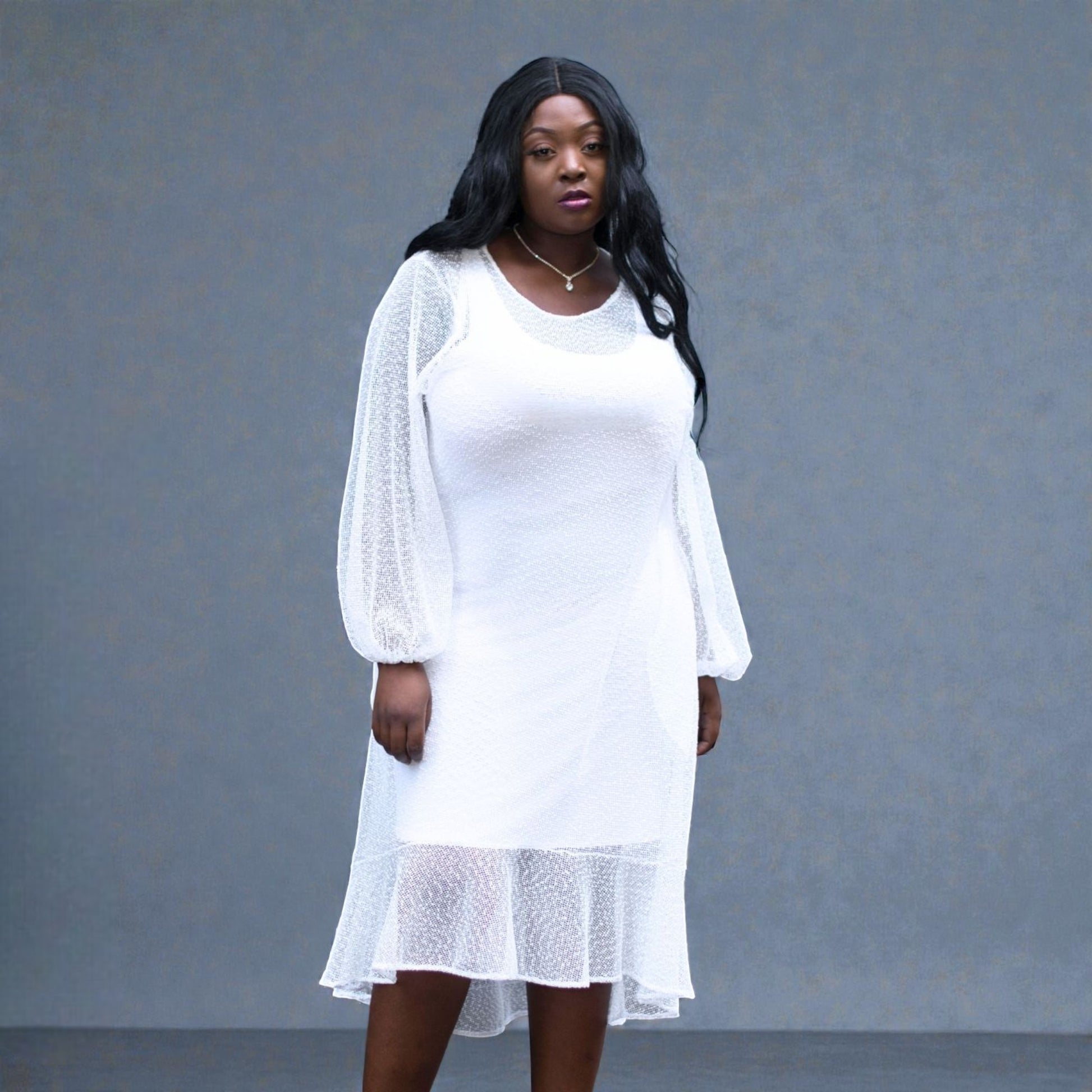 Women's Plus Size Aphrodite White Holiday Resort Dress with a white undergarment.