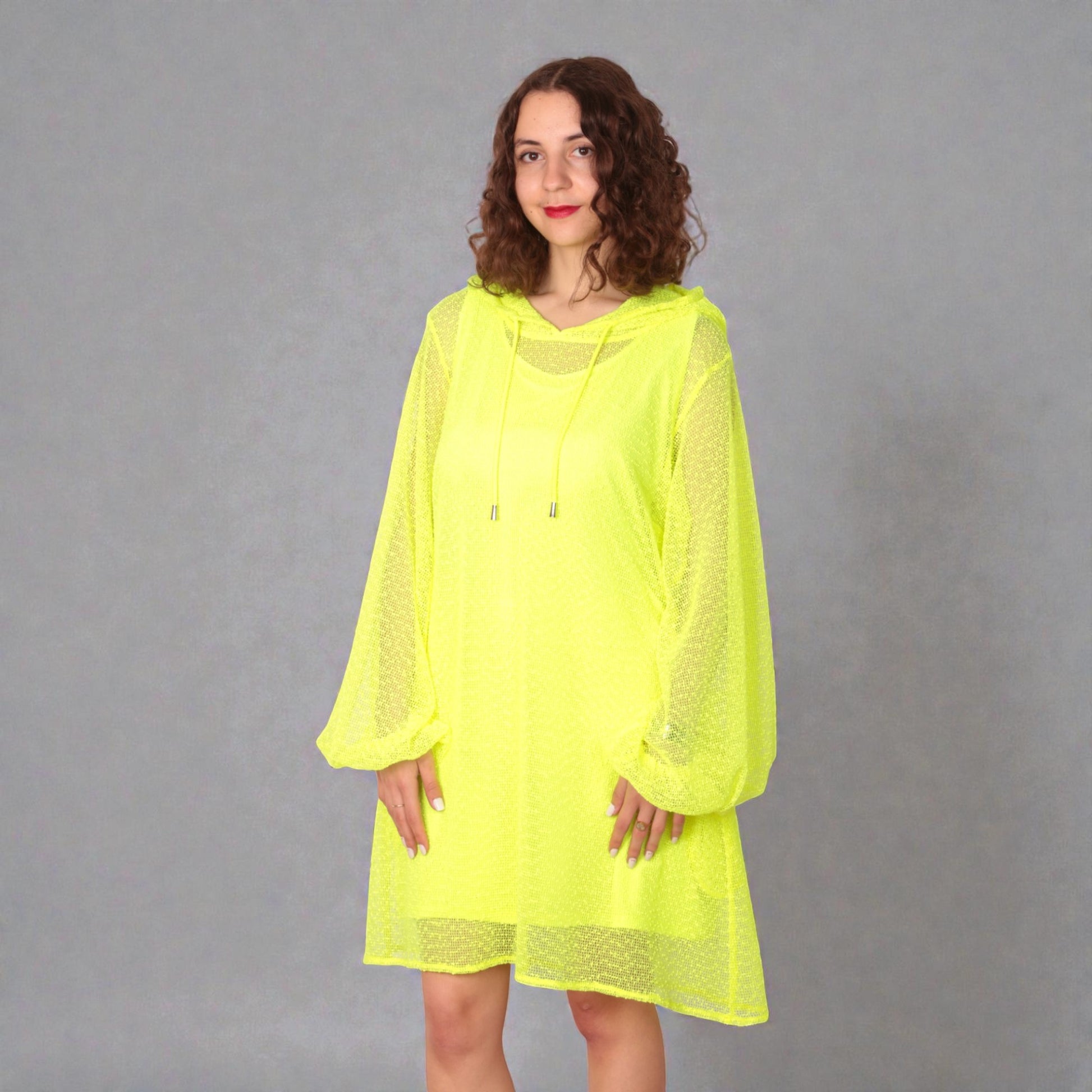 Women wearing a Aphrodite Neon Lime Holiday Resort Dress with matching neon lime undergarment and hoodie. Straight cut short version photographed from the front.