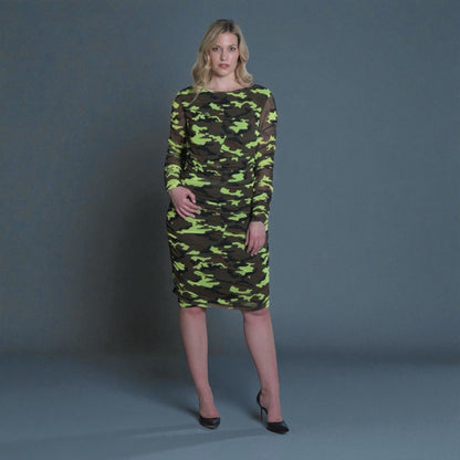Women's Mid Size Neon Lime Brown Black Camouflage Bodycon Midi Dress styled with black heels for a bold and chic look.Grey Background.