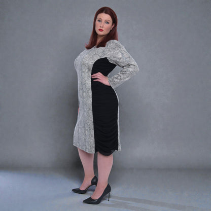 Women's Plus Size Black White Animal Print Bodycon Midi Vegan Leather Dress shown from the side, styled with black heels for a chic look.White Background.