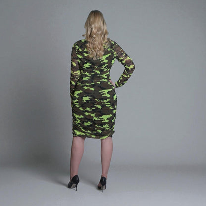 Women's Mid Size Neon Lime Brown Black Camouflage Bodycon Midi Dress styled with black heels for a bold and chic look.Grey Background.