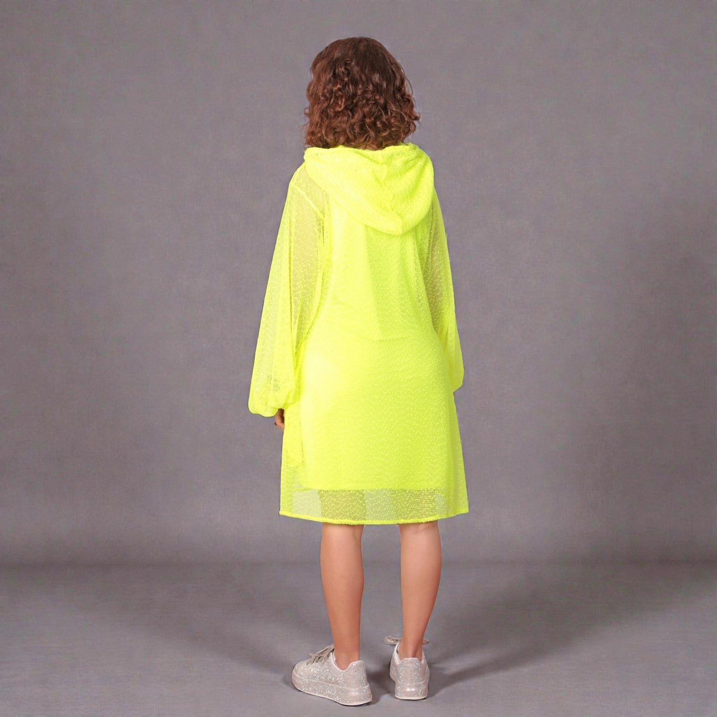 Women wearing a Aphrodite Neon Lime Holiday Resort Dress with matching neon lime undergarment and hoodie. Straight cut short version photographed from the back.