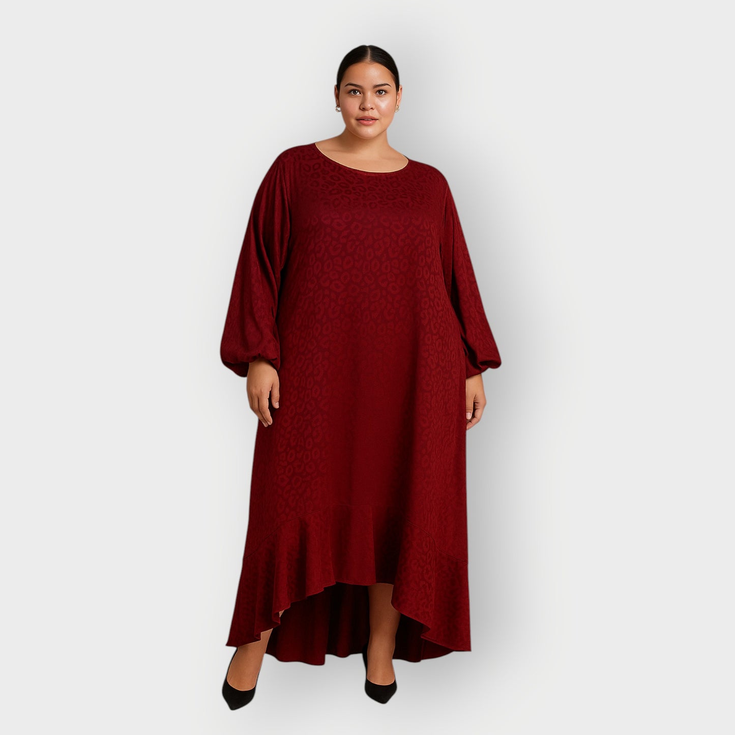 Plus Size Woman wearing a red burgundy Leopard dress against a white background