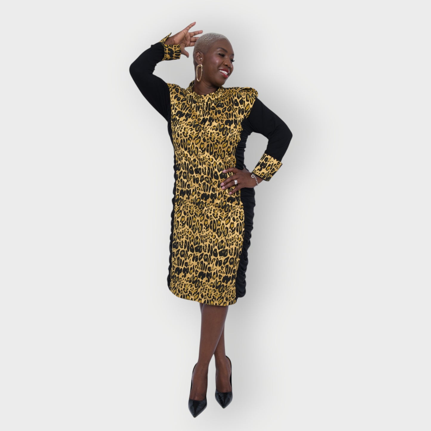 Women's Plus Size Black Gold Bodycon Midi Leopard Brocade Jacquard Dress styled with gold earrings and black heels for an elegant, polished look. White Background.
