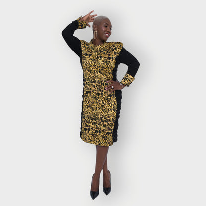 Women's Plus Size Black Gold Bodycon Midi Leopard Brocade Jacquard Dress styled with gold earrings and black heels for an elegant, polished look. White Background.