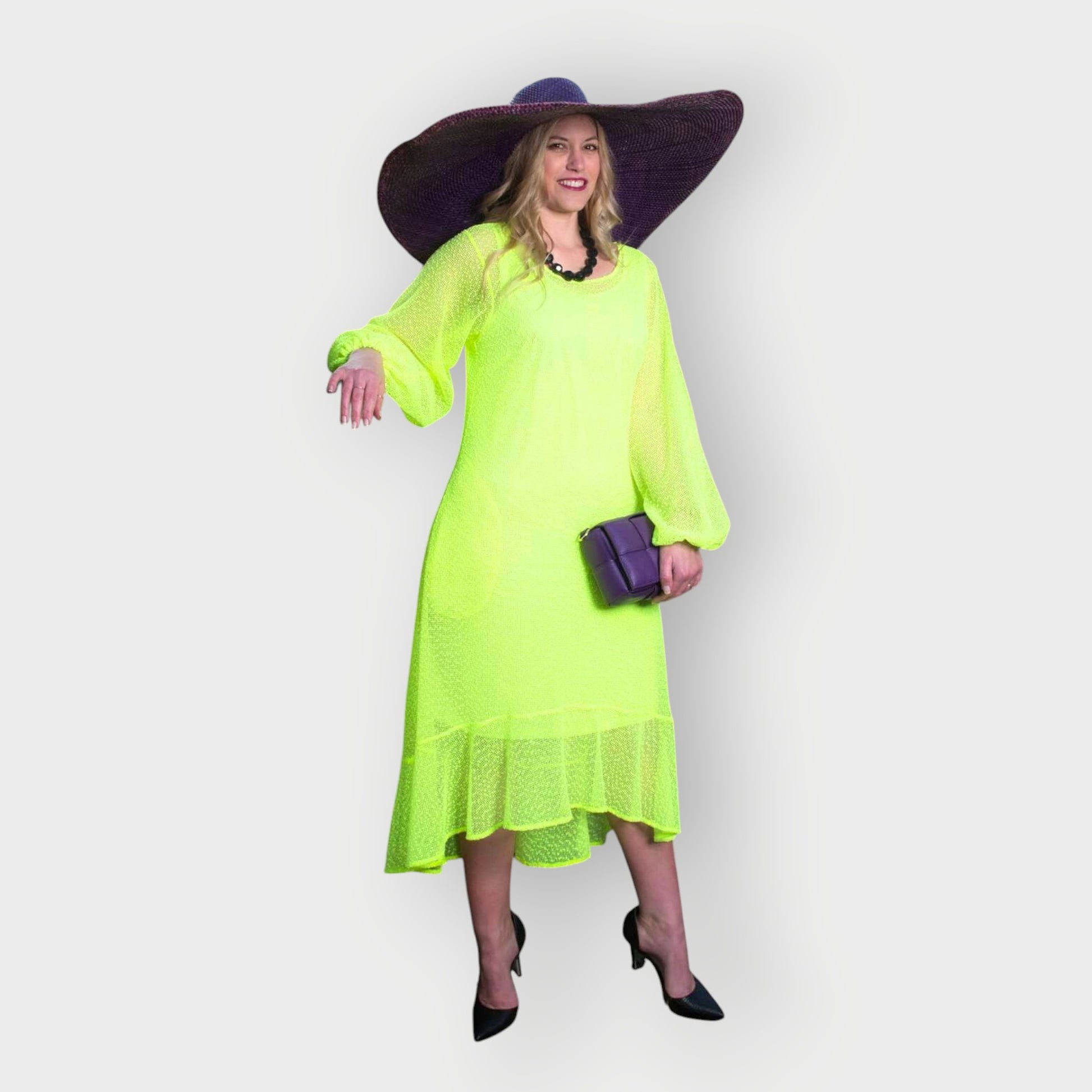 Women's Aphrodite Neon Lime Holiday Resort Dress with matching neon lime undergarment, styled with a purple sunhat, handbag, and black heels.