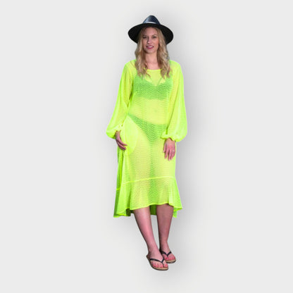 Women's Aphrodite Neon Lime Holiday Resort Dress styled with a bikini underneath, paired with a black hat and black flip-flops for a casual look.