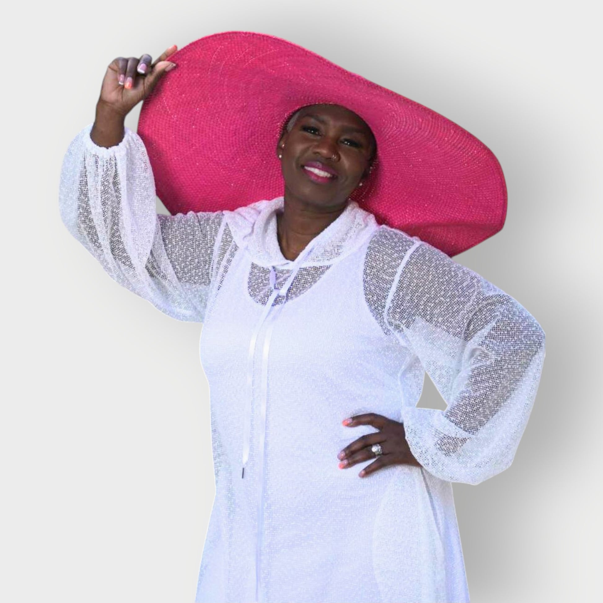 Women's Plus Size Aphrodite White Holiday Resort Dress with hoodie and white undergarment shown as a close up, paired with a pink sunhat.