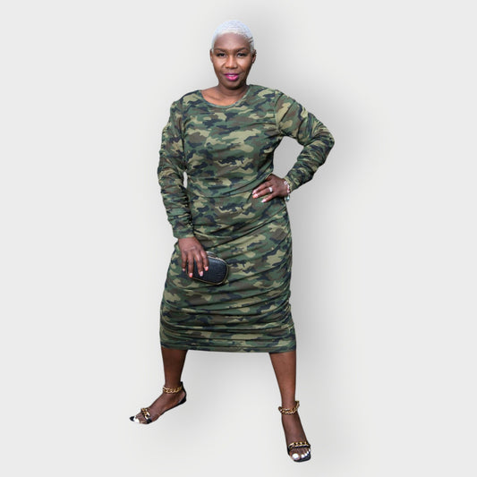 Women's Plus Size Olive Green Camouflage Bodycon Midi Dress styled with gold chain heels and a black and gold clutch for a sophisticated touch.