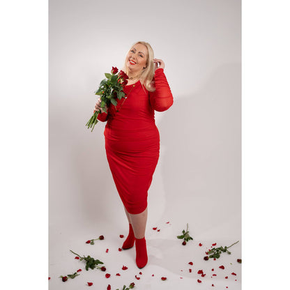 Women's Red Plus Size Boudicca Ruched Bodycon Midi Dress styled with gold jewelry and red heels, holding red roses for a romantic touch.