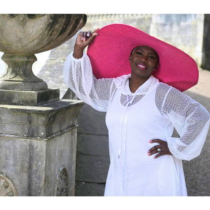 Women's Plus Size Aphrodite White Holiday Resort Dress with hoodie and white undergarment shown as a close up, paired with a pink sunhat.