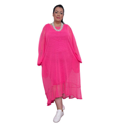 Women's Plus Size  Aphrodite Hot Pink Holiday Resort Dress with a  hot pink undergarment, paired with a white necklace and white sneakers