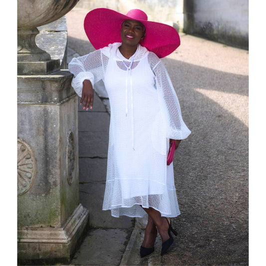 Women's Plus Size Aphrodite White Holiday Resort Dress with hoodie and white undergarment, paired with a pink sunhat, pink clutch, and black heels.