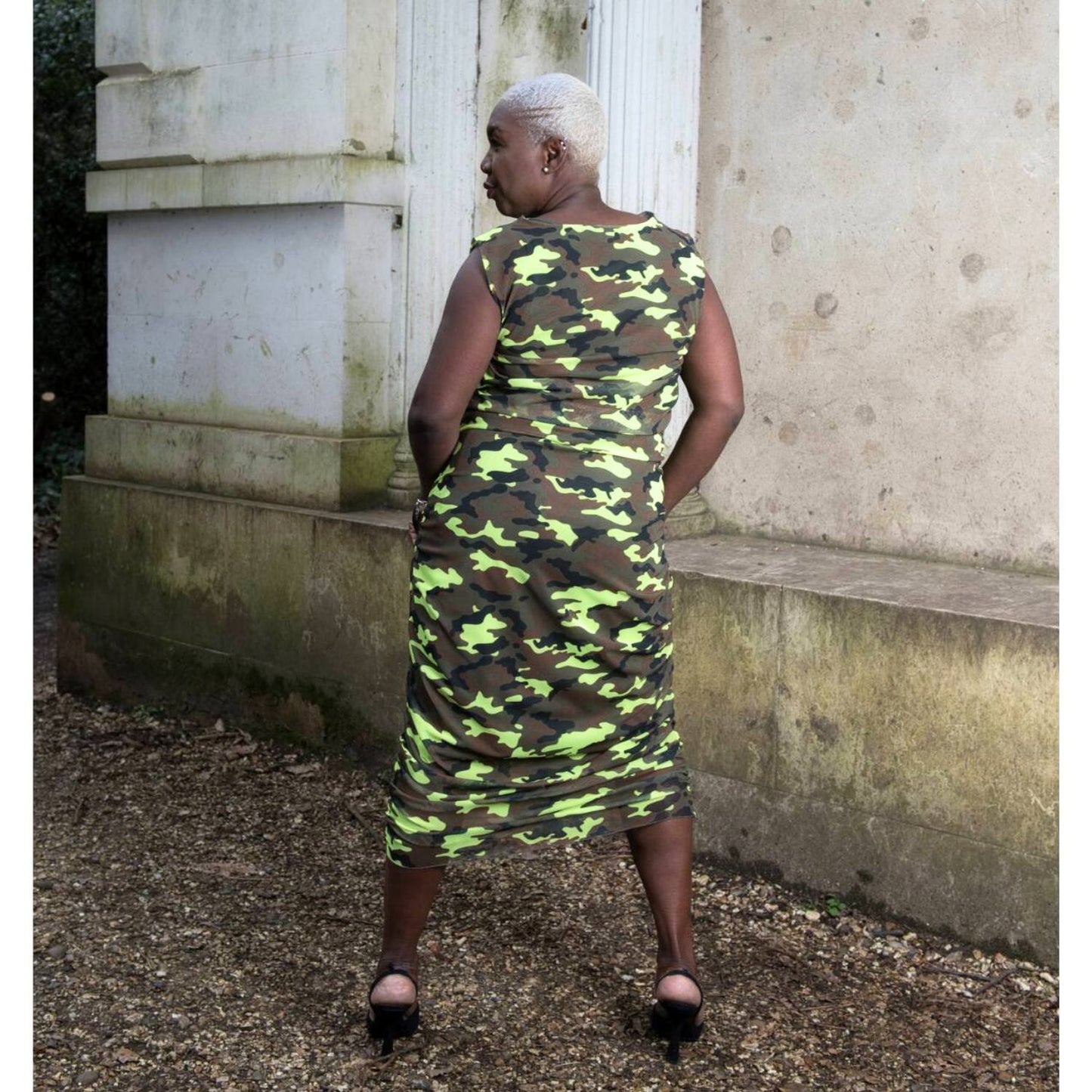 Women's Summer Plus Size Neon Lime Black Brown Camouflage Bodycon Midi Dress shown from the back, styled with black heels for a bold, chic look.