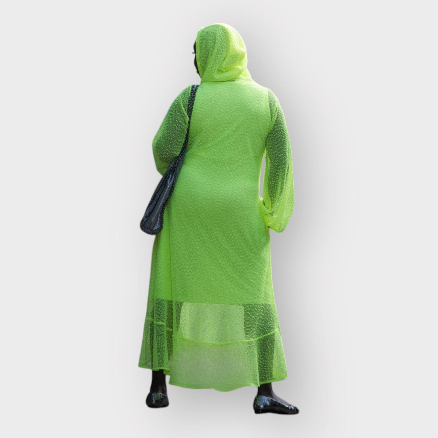 Women's Aphrodite Neon Lime Holiday Resort Dress with hoodie and matching neon lime undergarment shown from the back, styled with a silver  handbag and silver flats.