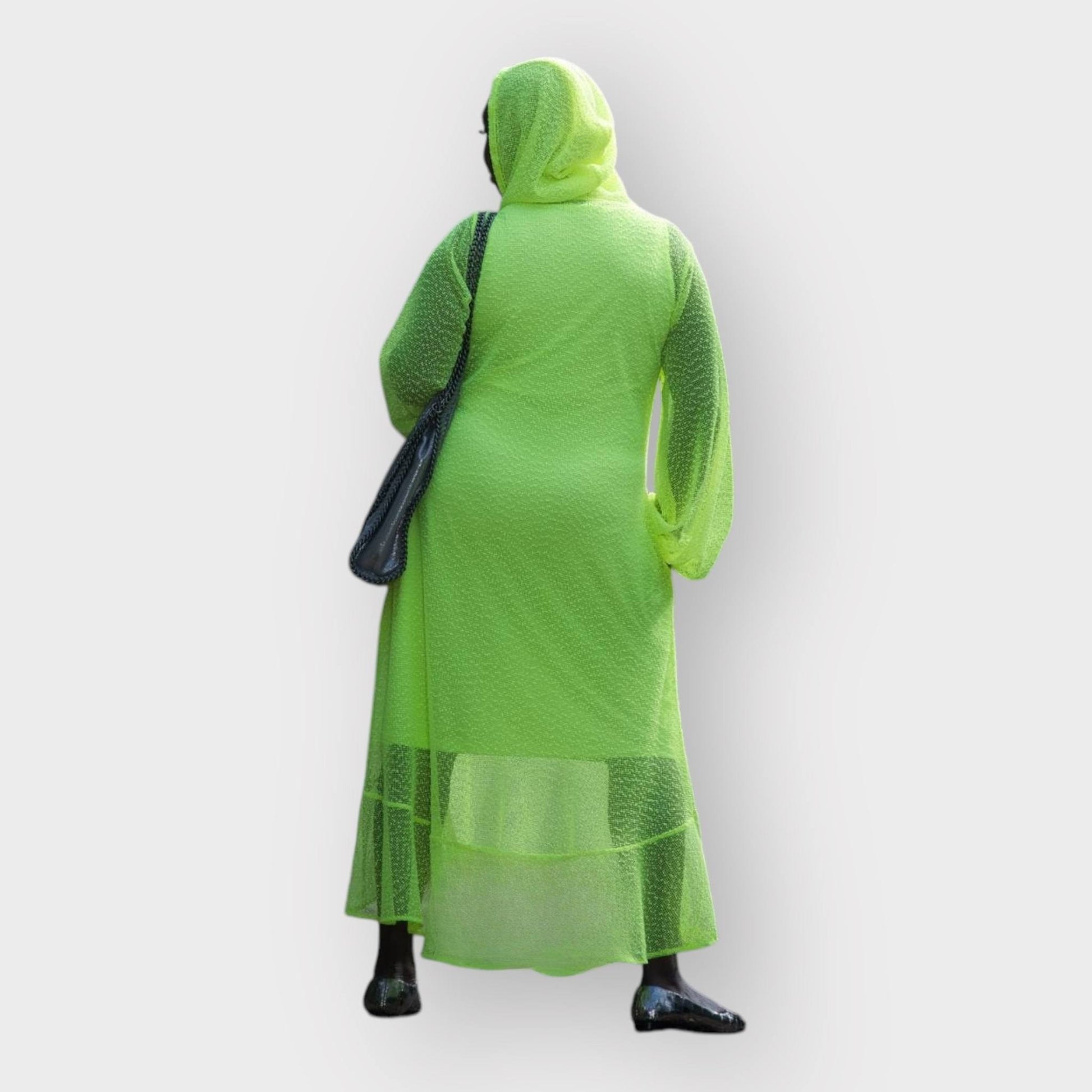 Women's Aphrodite Neon Lime Holiday Resort Dress with hoodie and matching neon lime undergarment shown from the back, styled with a silver  handbag and silver flats.