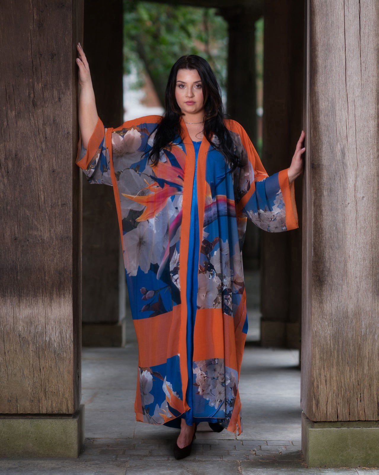 Women's White and Blue Plus Size Georgette Cherry Blossom Kimono styled with a blue dress and black heels.