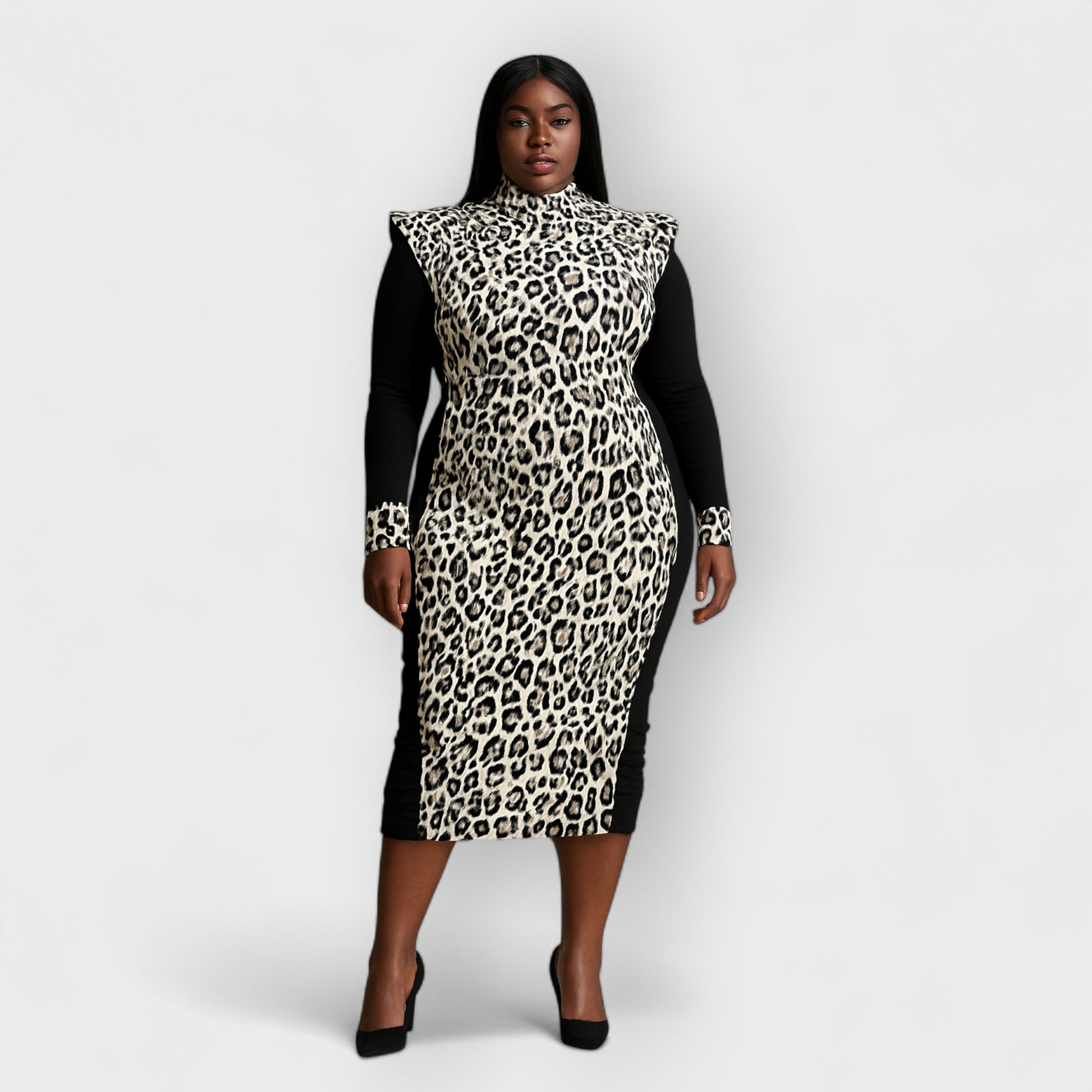 Woman wearing a black white leopard print dress with black sleeves on a white background