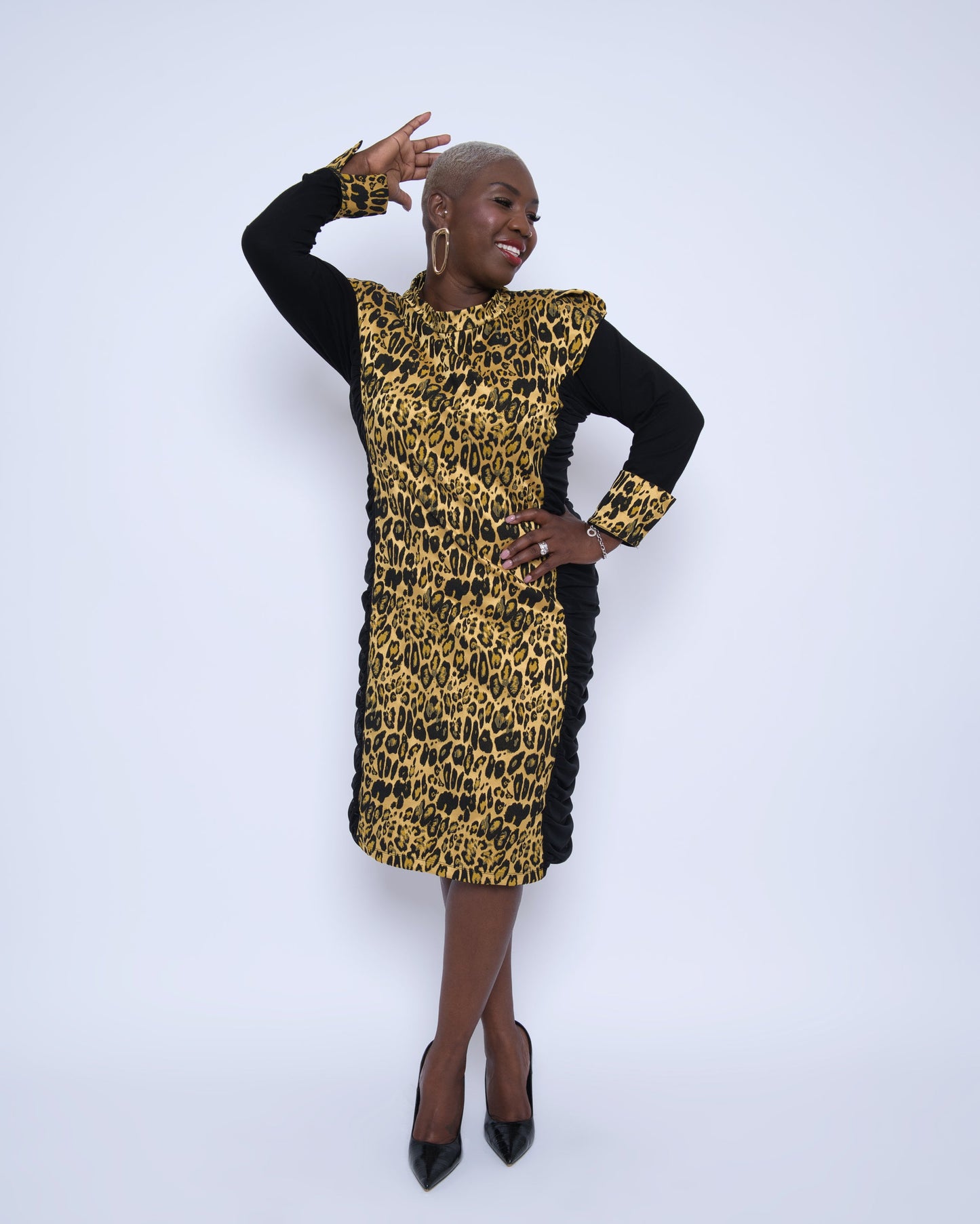 Women's Plus Size Black Gold Bodycon Midi Leopard Brocade Jacquard Dress styled with gold earrings and black heels for an elegant, polished look.