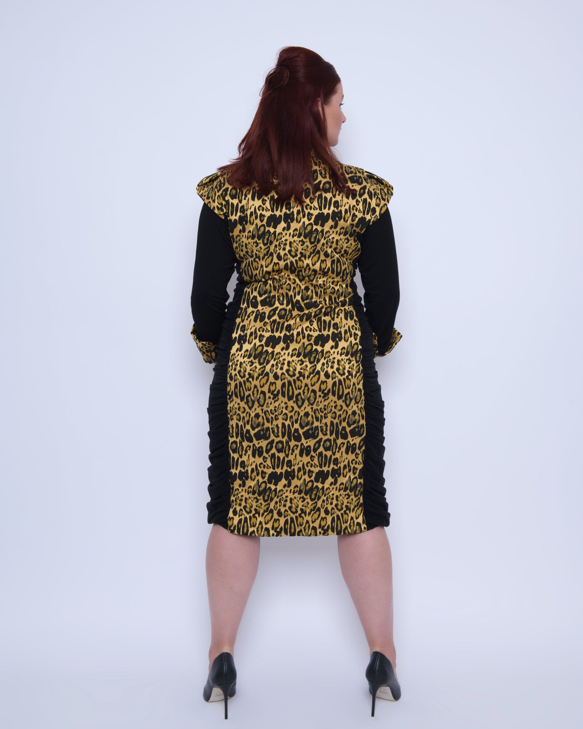 Women's Plus Size Black Gold Bodycon Midi Leopard Brocade Jacquard Dress shown from the back, styled with black heels for an elegant, polished look.